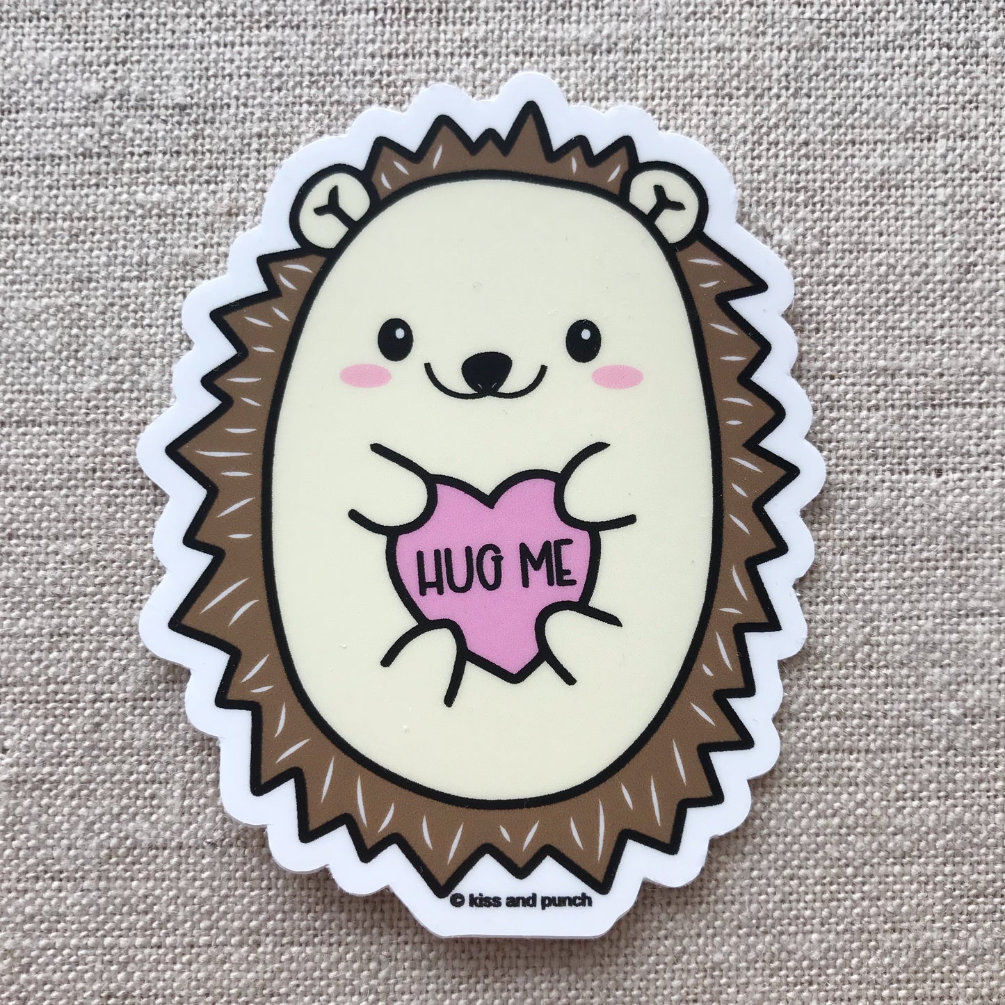 Cute hedgehog sticker says hug me on fabric