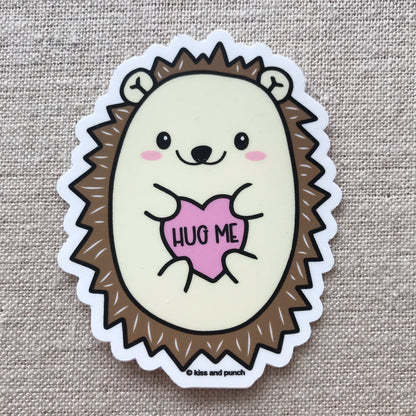 Cute hedgehog sticker says hug me on fabric